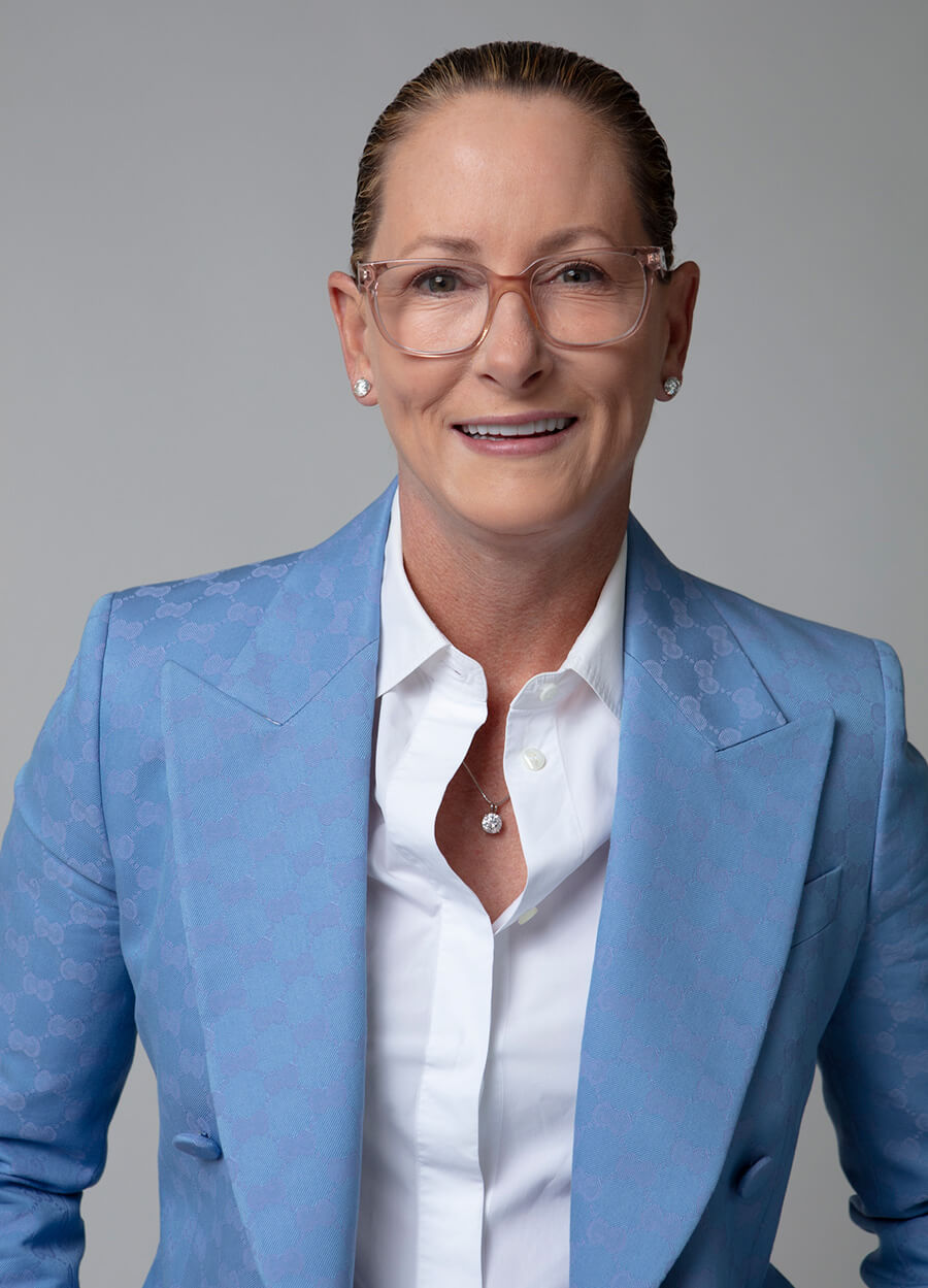 Dr. Flint in a light blue suit