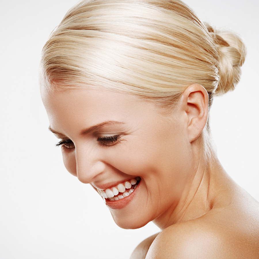 Profile of a blonde woman smiling